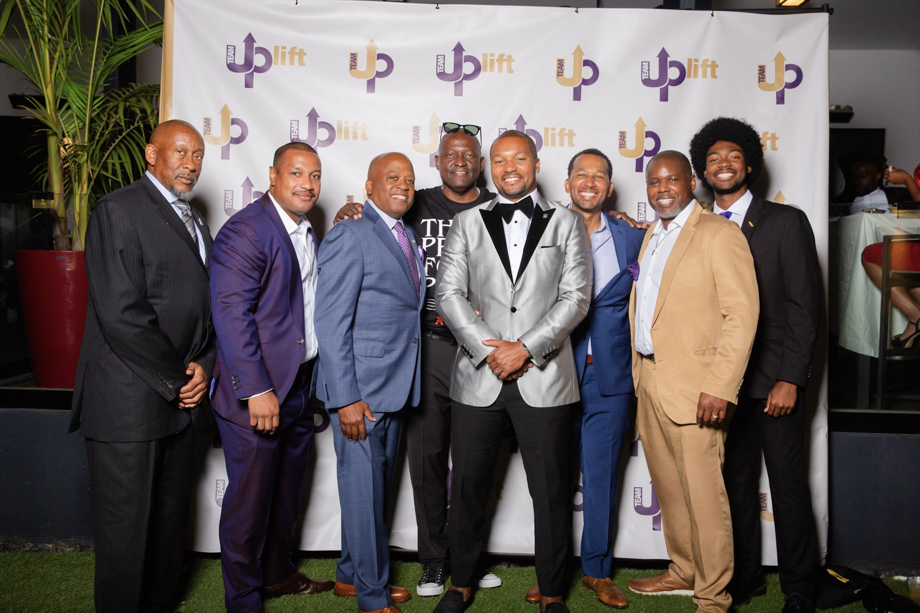Members of Team Uplift and Lambda Omicron Chapter at a community gala